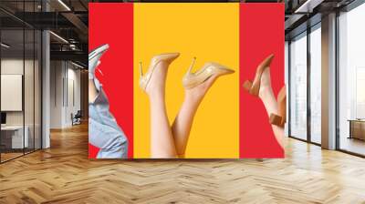 Collage of female legs in different stylish shoes on color background Wall mural