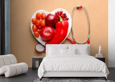 Collage of heart shaped plates with healthy products and stethoscopes on color background Wall mural