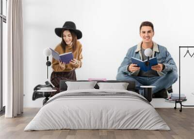 Collage of sitting young people with books on white background Wall mural