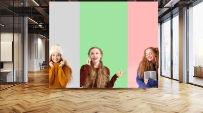 Collage of stylish young woman in sweaters on color background Wall mural