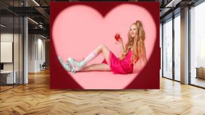 Collage of stylish young woman with roller skates, disco balls and record player on pink background Wall mural