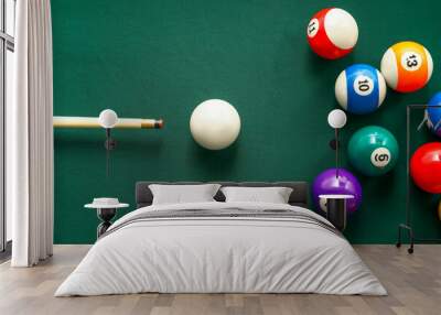 Colorful billiard balls with cue on table Wall mural