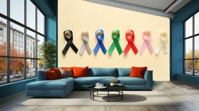 Colorful ribbons on yellow background. World Cancer Day Wall mural