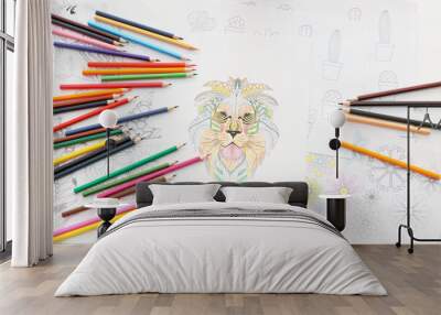 Coloring pictures and pencils on table Wall mural