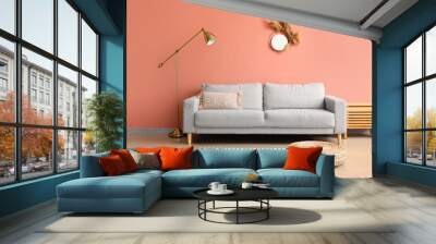 Comfortable sofa and stylish lamp near pink wall Wall mural