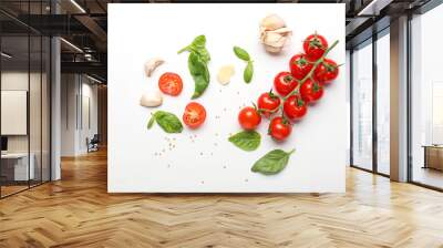 Composition with basil, tomatoes and spices on white background Wall mural