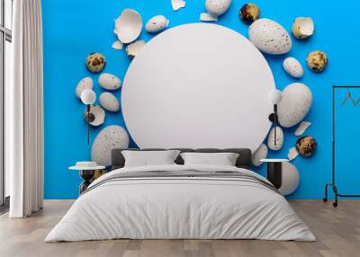 Composition with blank greeting card and Easter eggs on blue background Wall mural