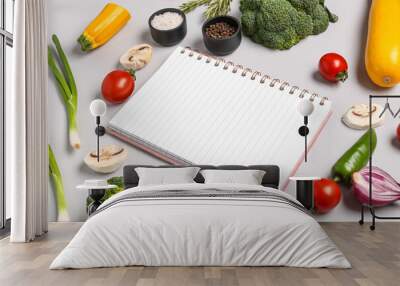 Composition with blank recipe book, fresh vegetables and spices on grey background Wall mural