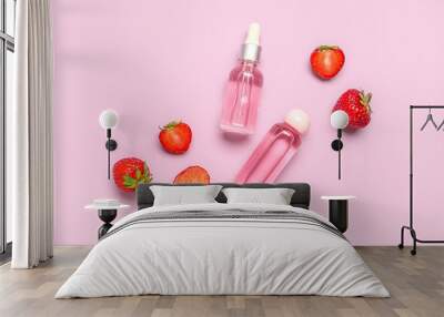 Composition with bottles of cosmetic products and fresh strawberry on color background Wall mural