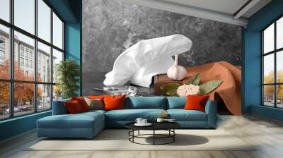 Composition with chef's hat on kitchen table Wall mural