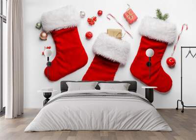 Composition with Christmas socks on white background Wall mural