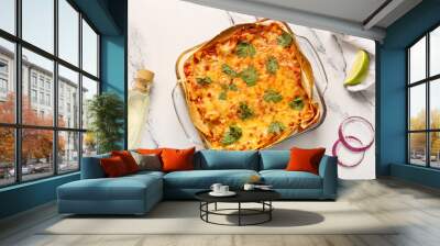 Composition with delicious enchilada and spices on light background Wall mural