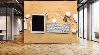 Composition with different modern gadgets on wooden background Wall mural