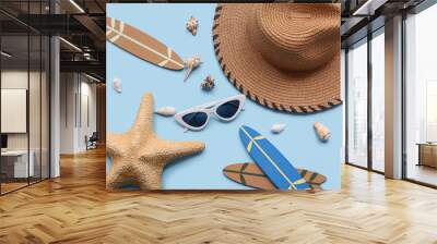 Composition with female beach accessories, mini surfboards and seashells on color background Wall mural