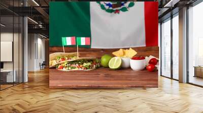 Composition with Mexican traditional food and flags on wooden table Wall mural