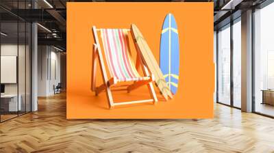 Composition with mini surfboards and deckchair on orange background Wall mural