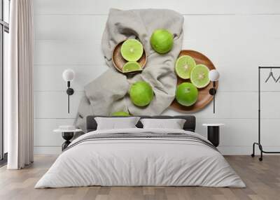 Composition with ripe bergamot fruits on light wooden background Wall mural