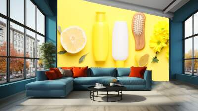 Composition with shampoo, brush and natural ingredients on yellow background Wall mural