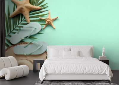 Composition with stylish beach accessories, starfishes and palm leaf on color background Wall mural