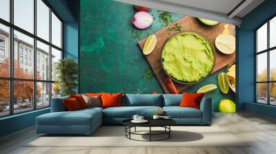 Composition with tasty guacamole and nachos on color background Wall mural