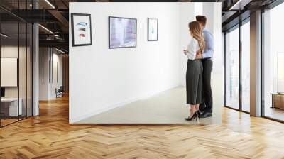 Couple at exhibition in modern art gallery Wall mural