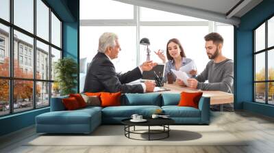 Couple meeting with notary public in office Wall mural