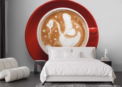 Cup of coffee with latte art on light background Wall mural