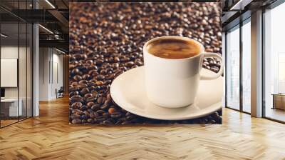 Cup of hot coffee on roasted beans Wall mural