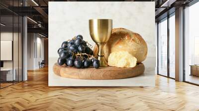 Cup of wine with grapes and bread on light background Wall mural