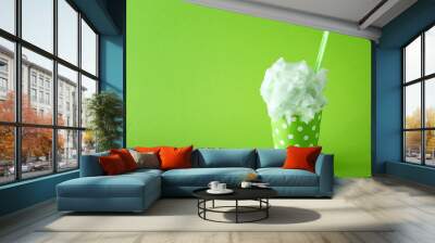 Cup with tasty cotton candy on color background Wall mural