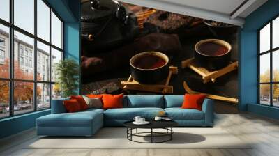 Cups of hot aromatic puer tea on dark wooden table Wall mural