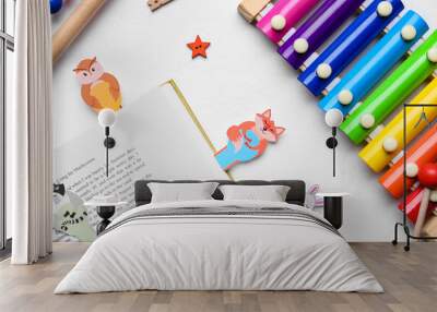 Cute bookmarks with book and xylophone on light background Wall mural