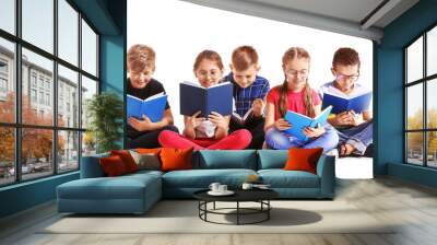 Cute little children reading books on white background Wall mural