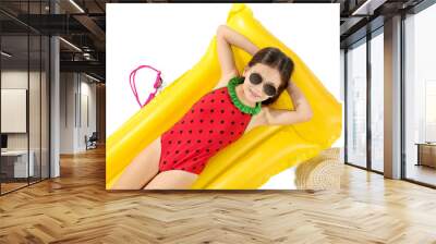 Cute little girl lying on inflatable mattress against white background Wall mural