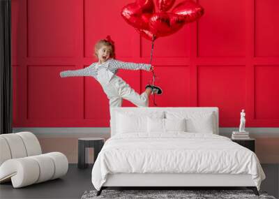 Cute little girl with air balloons on color background. Valentines Day celebration Wall mural