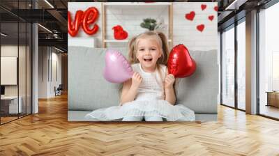 Cute little girl with red heart shaped balloons in room decorated for Valentines Day Wall mural