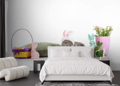 Cute Scottish Fold cat with Easter eggs, rabbits, roses and pillow on white background Wall mural