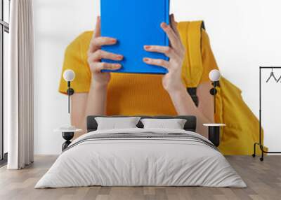 Cute teenage girl with books on white background Wall mural