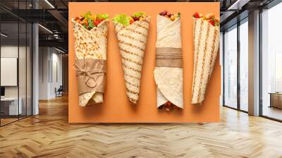 Delicious burritos on color background Wall mural