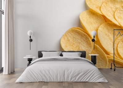 Delicious potato chips on white background Wall mural