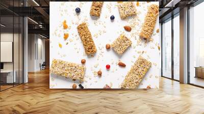 Different granola bars on white background Wall mural