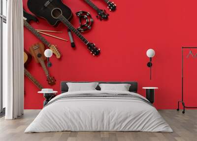 Different musical instruments on red background Wall mural