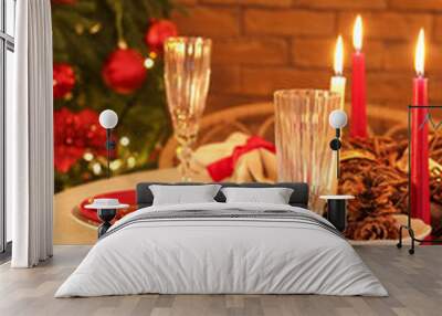 Dining table with Christmas setting and burning candles in room, closeup Wall mural