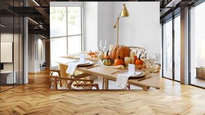 Dining table with pumpkins near window in room Wall mural