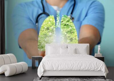 Doctor holding human lungs made of green tree crown, closeup Wall mural