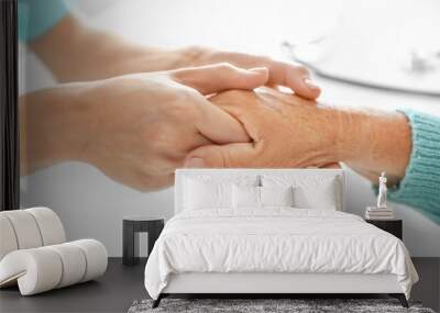 Doctor supporting elderly woman in clinic, closeup Wall mural