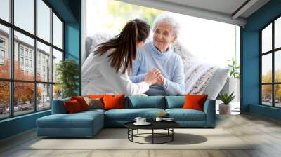 Doctor with senior woman in nursing home Wall mural