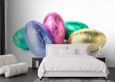 Easter eggs in foil on white background Wall mural