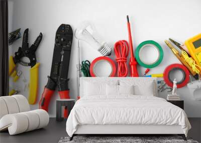 Electrician's supplies on white background Wall mural