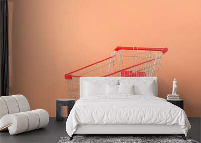 Empty shopping cart near color wall Wall mural